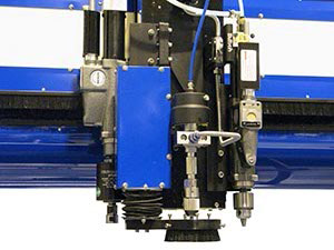 Tapping Tool, Drill, Cutting Head, and Height Sensor all mounted onto a single waterjet Z-Carriage