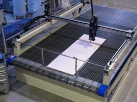 J-138 Waterjet Cutting System, loading material into the front using the guides